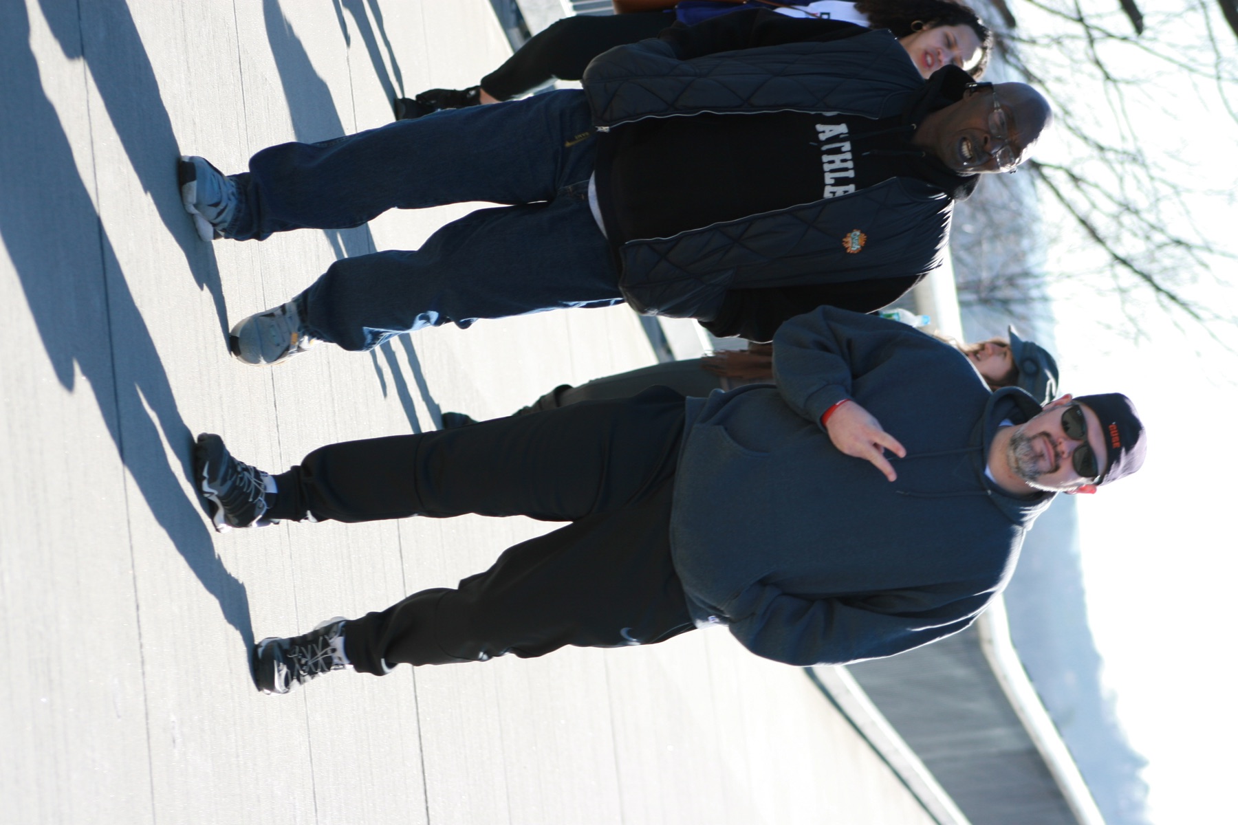 Zachary walking outdoors with other people