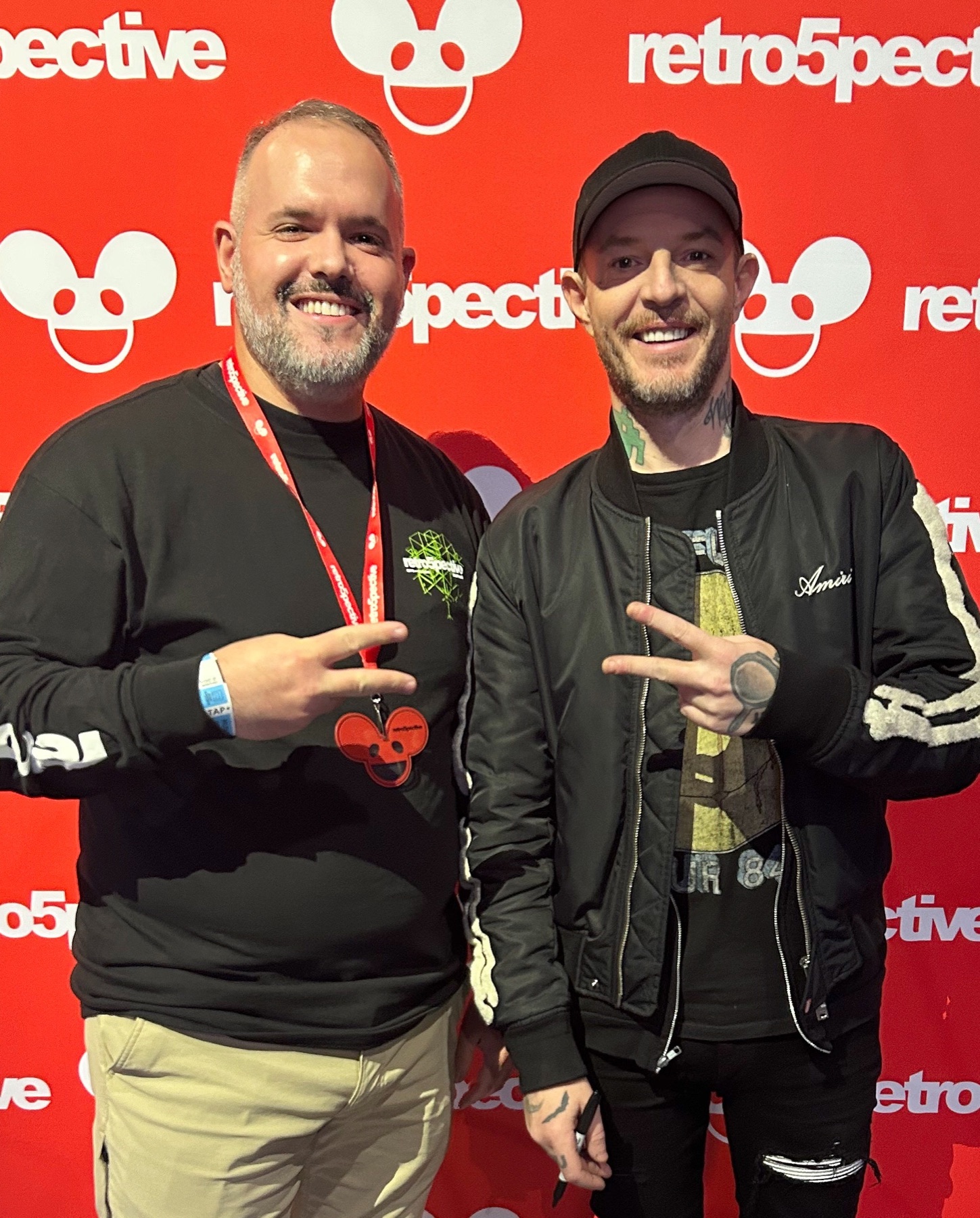 Zachary with a musician at a music event